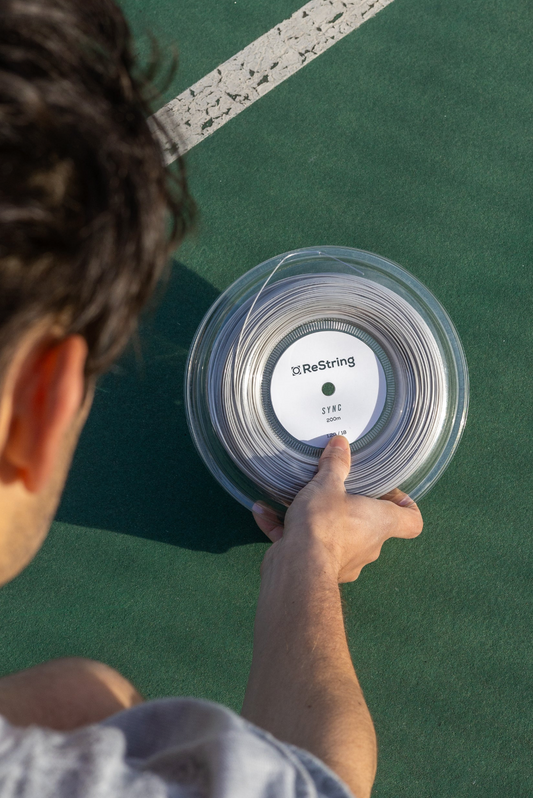 Restring Sync Reel in silver tennis strings with good snapback suitable for tennis players similar to solinco hyper g and babolat rpm blast. Available to buy in Australia and New Zealand via The Tennis Store